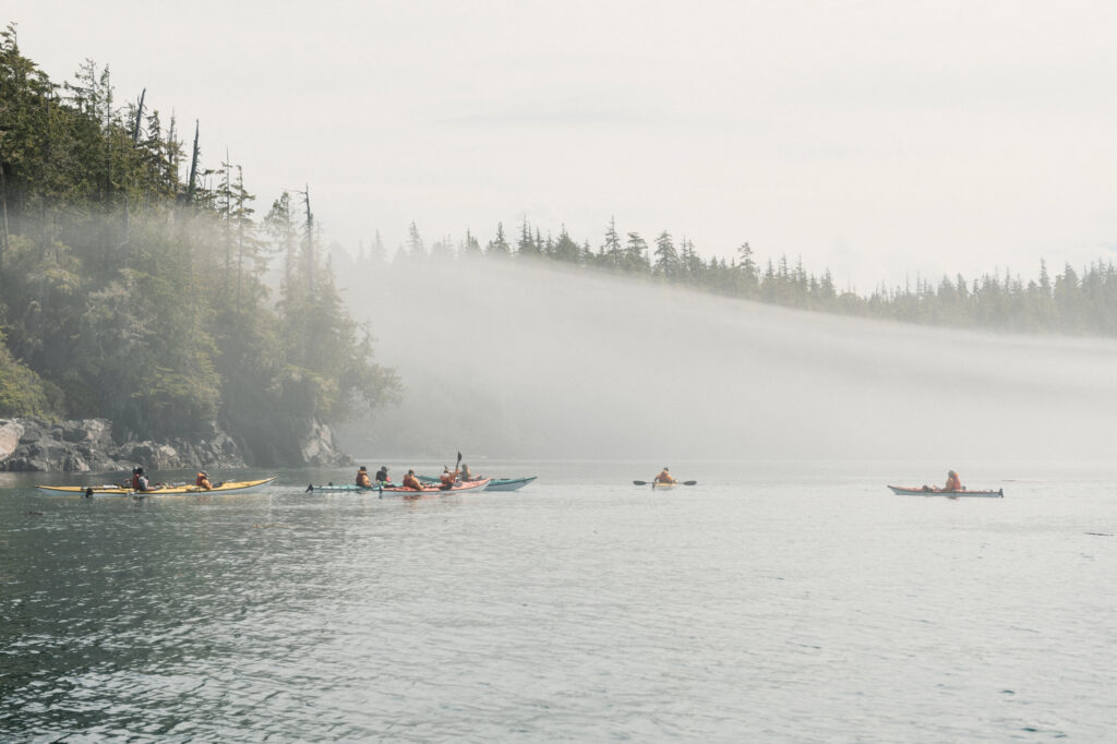 Group of kayakers in the fog